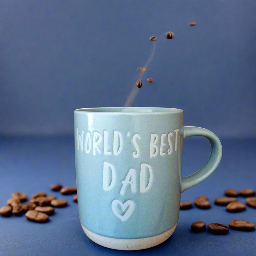 Blue mug with 'World's Best Dad' text on a blue background with coffee beans.