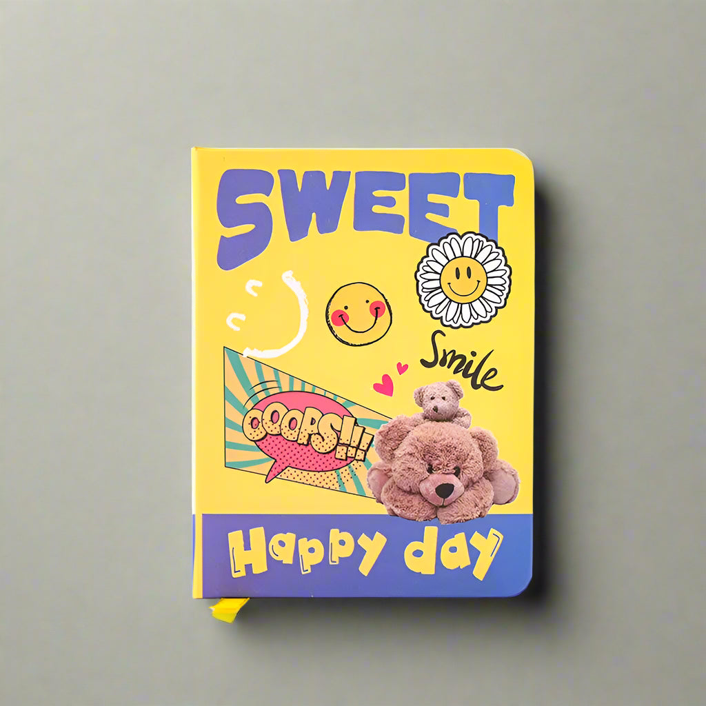 Colorful notebook with cartoon designs and text on a white background