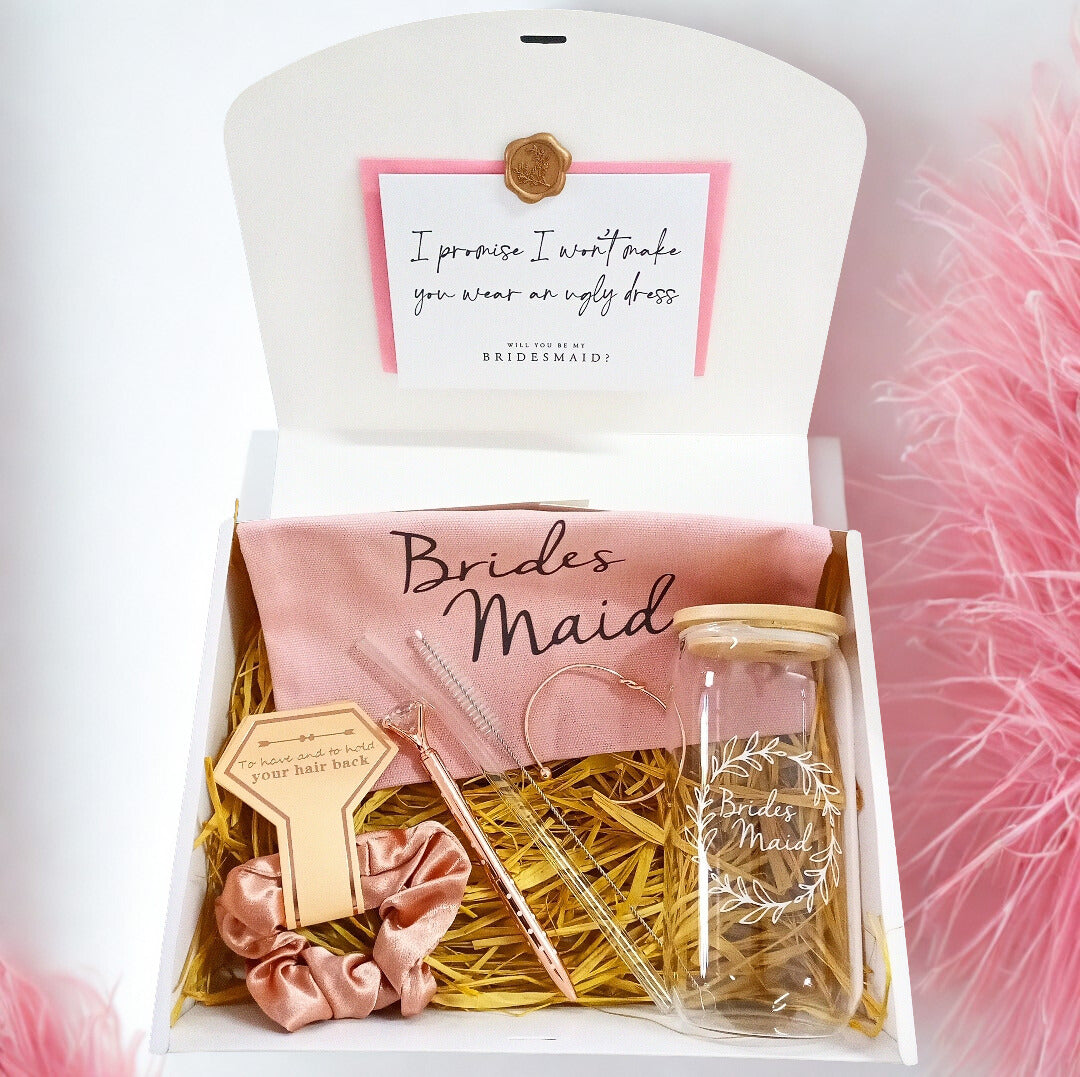 Gift set for bridesmaids with a card, hair accessories, and a bottle in a box.